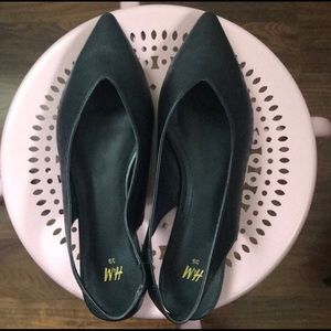Black pointed sling back flats